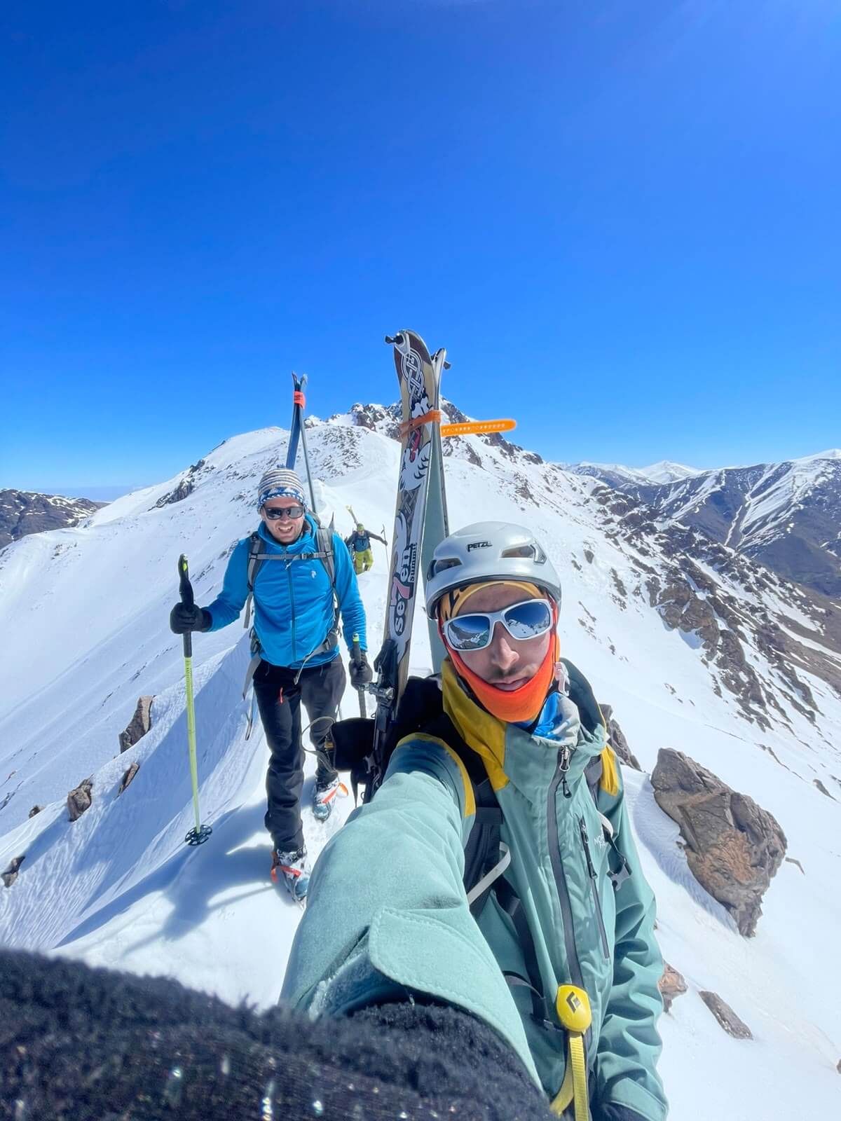 Radouane with ski clients on a ridge at Tizi Likemt