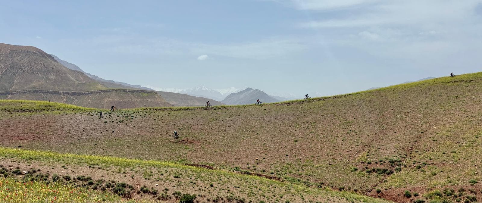 Mountain biking across a ridge in the Amezmiz region