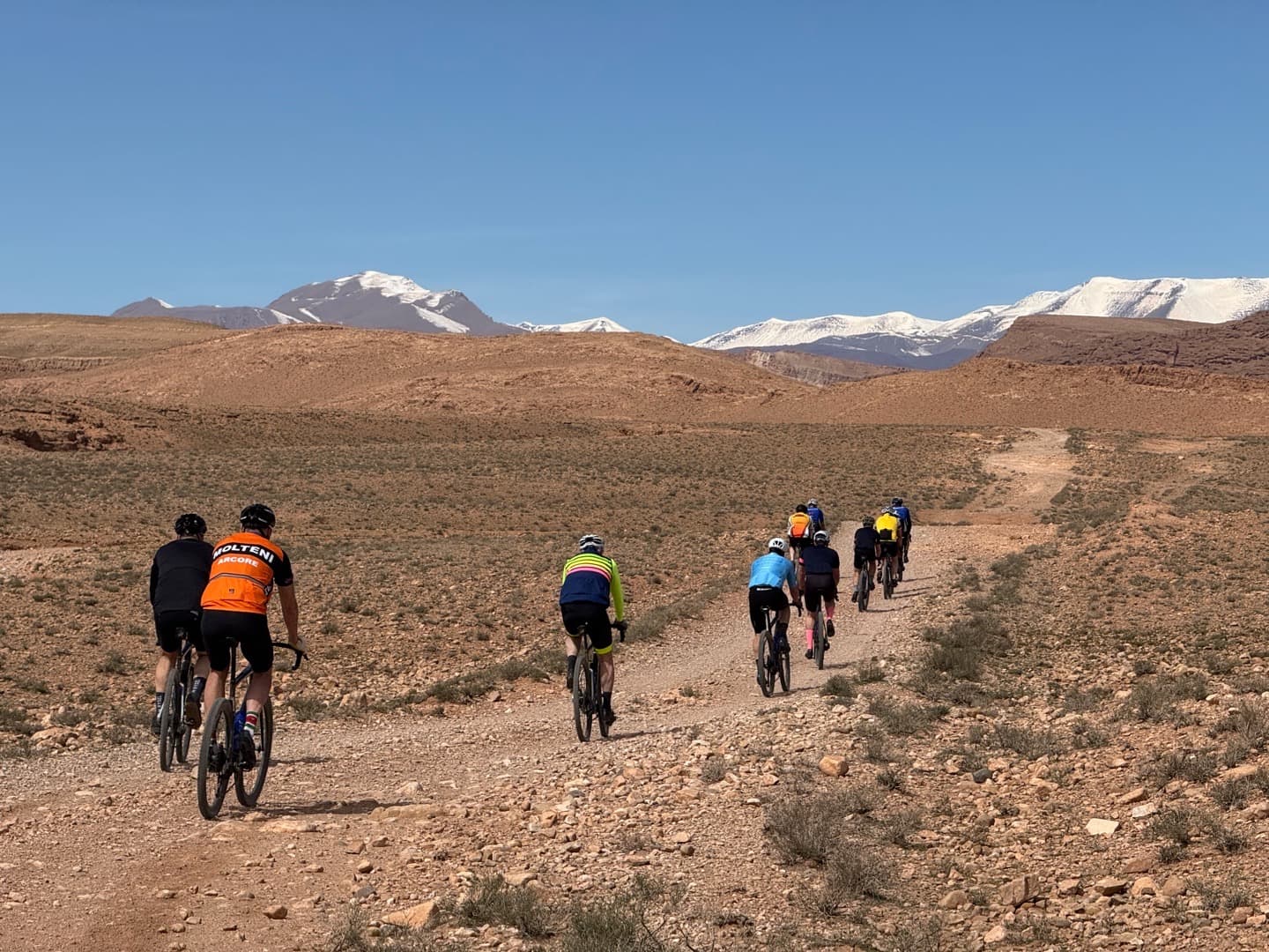 Gravel cyclist riding through the Atlas Mountains in Morocco