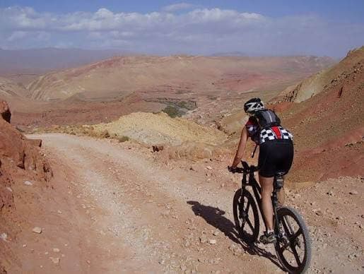 Mountain biker on a remote dirt route in the Saghro Mountains