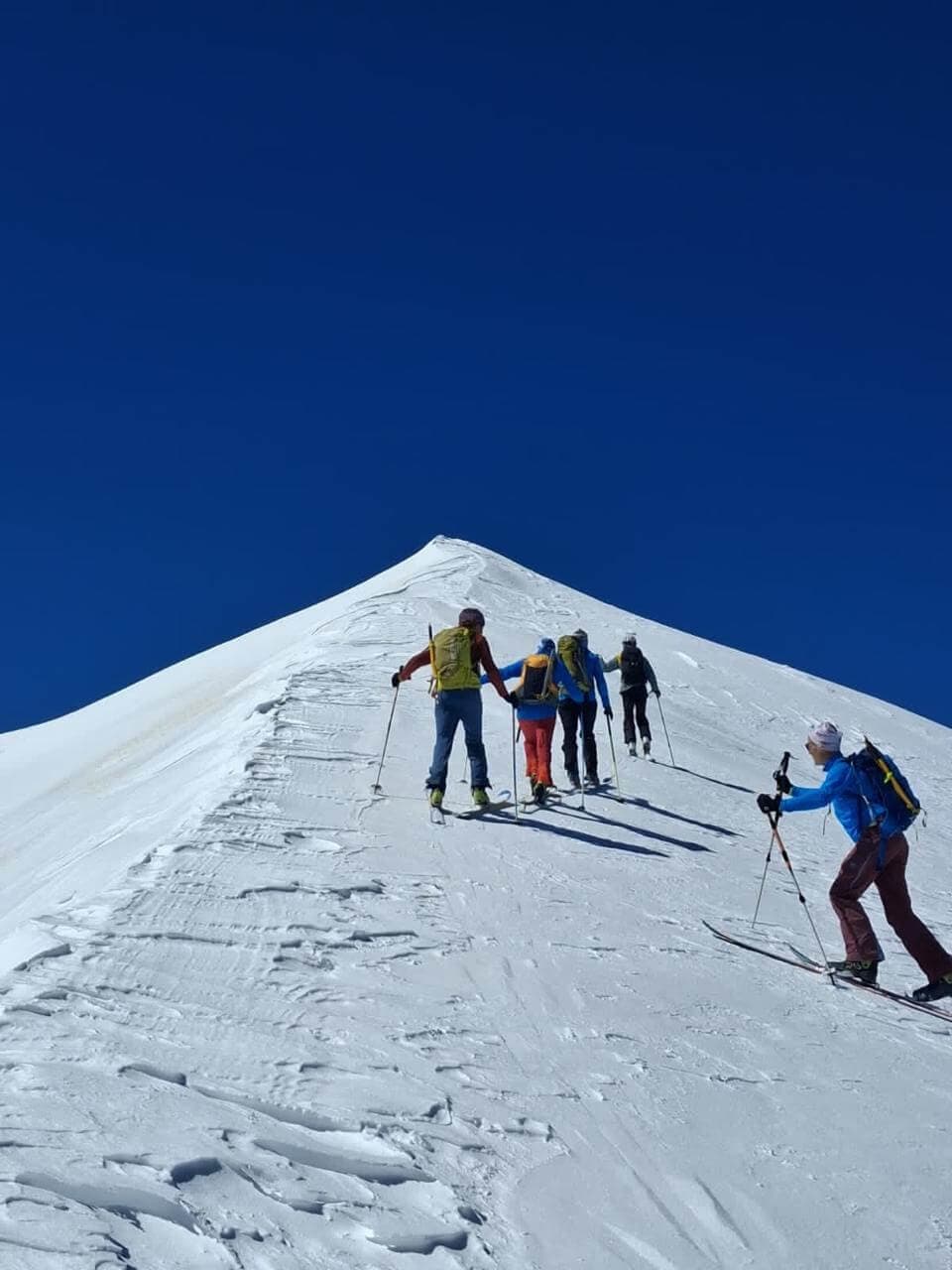 Skiers climbing through snow in the High Atlas near Mgoun