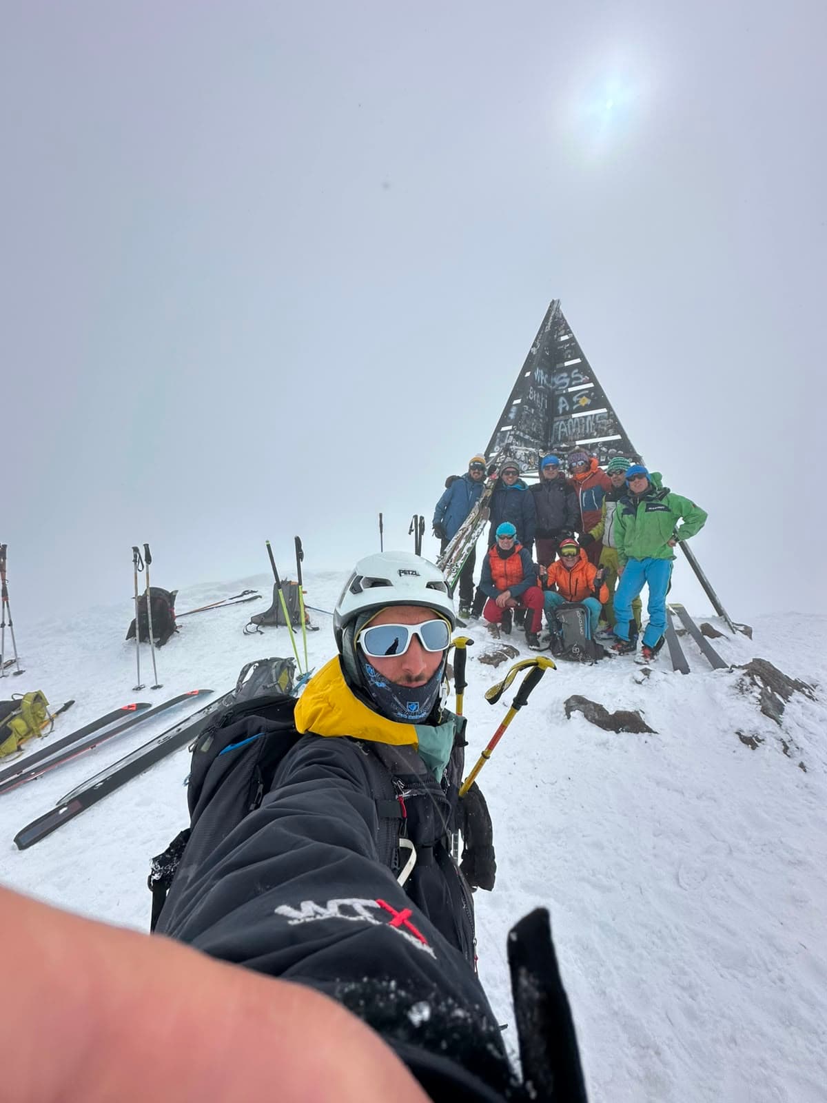 Ski tourers on the summit of Mount Toubkal