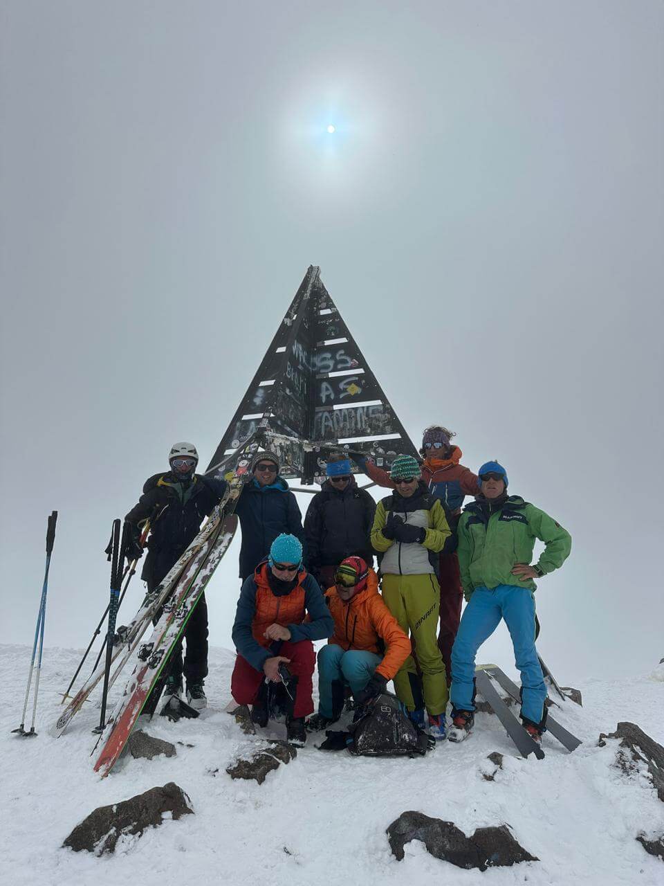 Ski touring group on the summit of Mount Toubkal